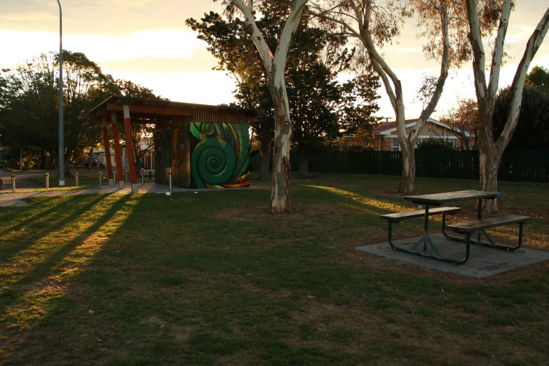 an empty picnic table is shown in the park