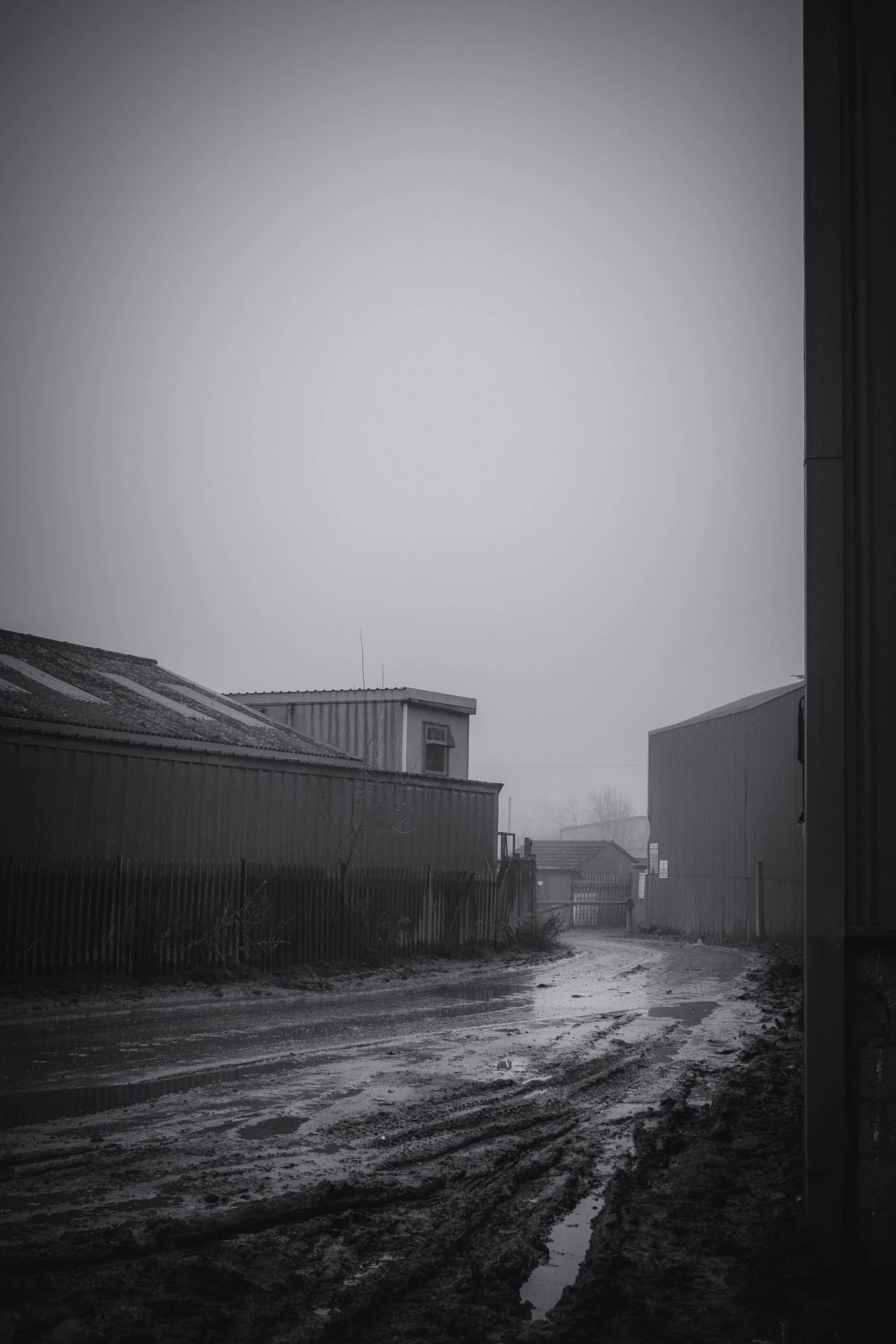 a black and white po of snow, dles, and a building