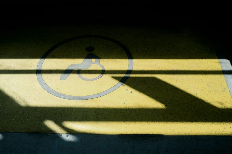 the shadows of pedestrian signs over a road