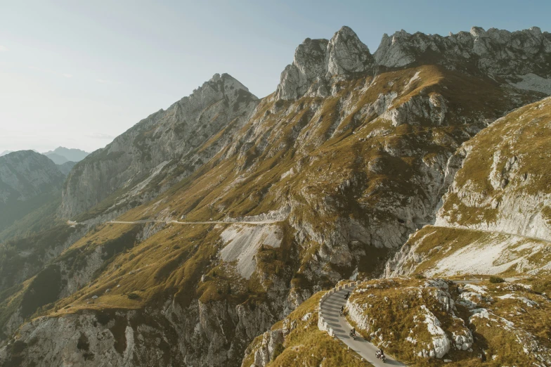 winding mountain road in the middle of a huge cliff