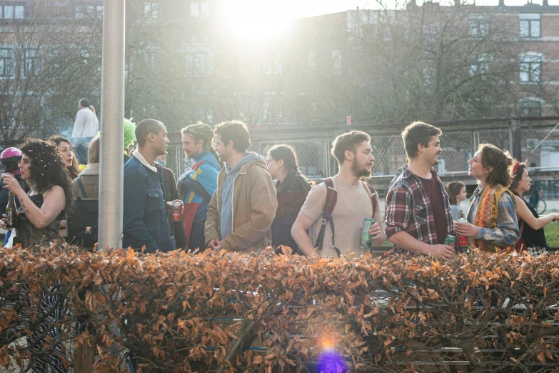 the men and women are standing around in the courtyard