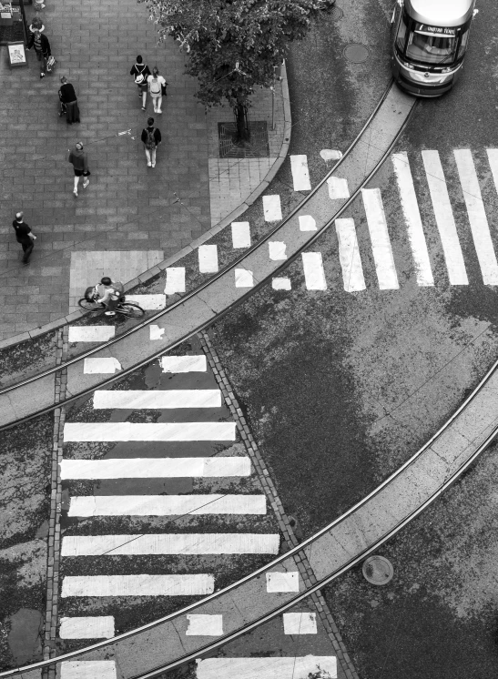 an aerial view of a crosswalk in a busy city