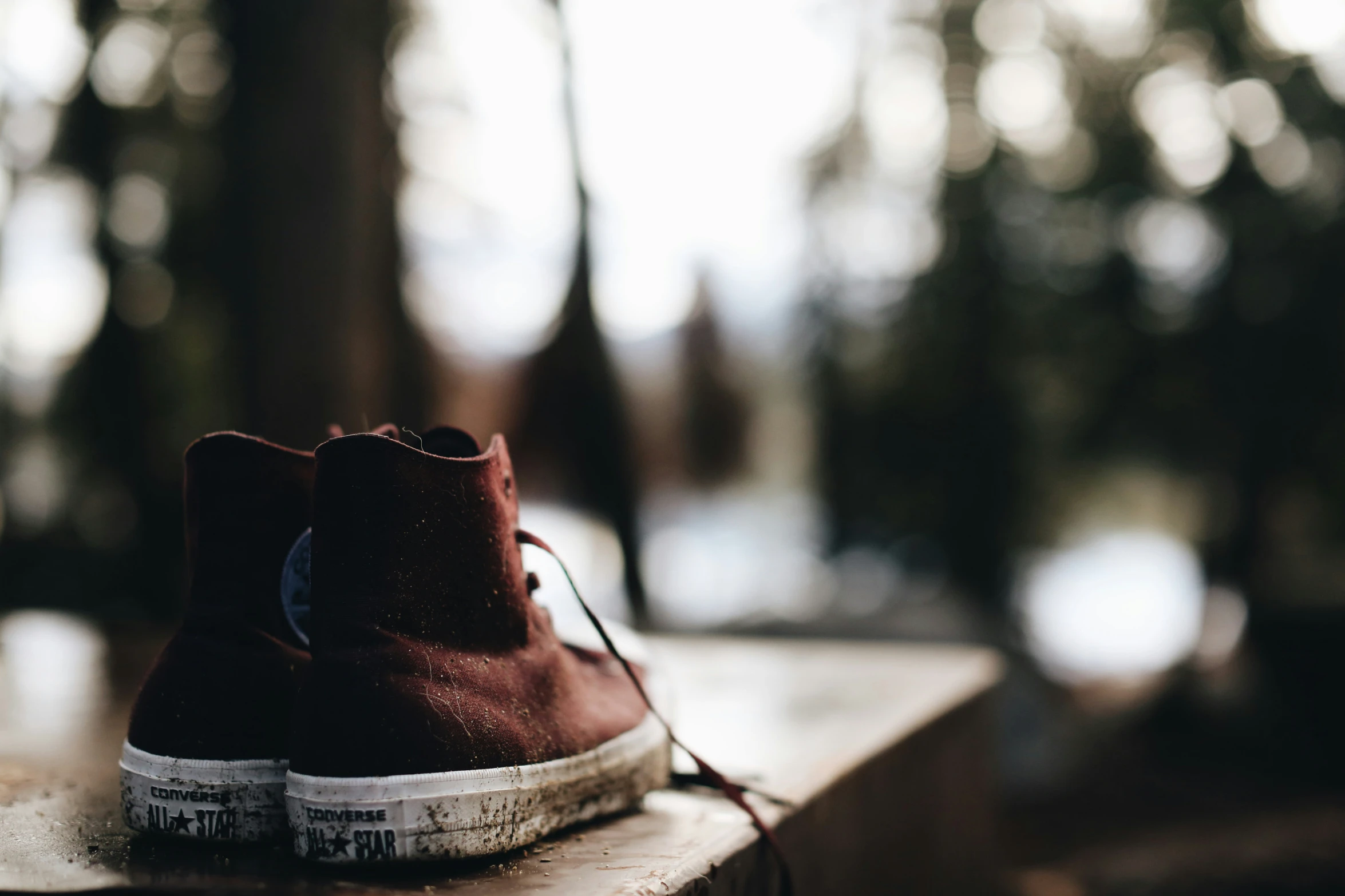 an empty tennis shoe is shown with a blurry background