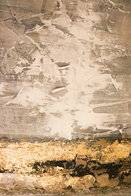 a plane wing flying over an area covered in snow