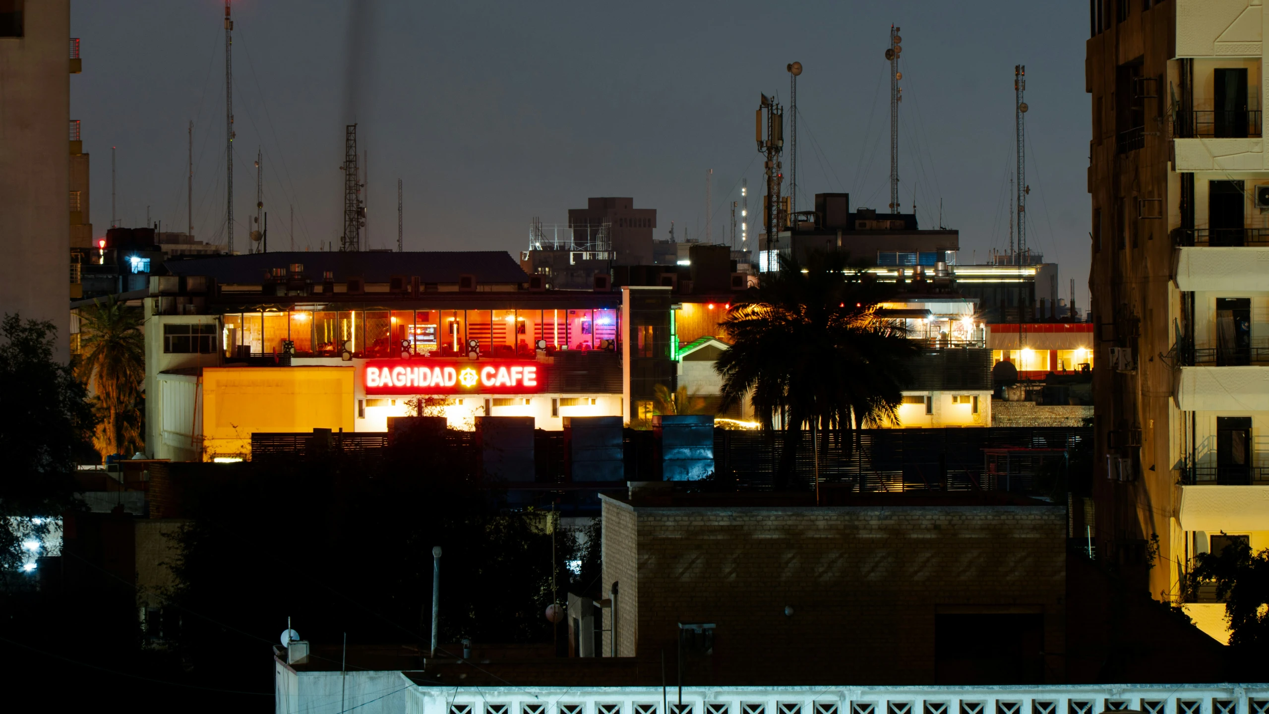 buildings with lights on at night in a city