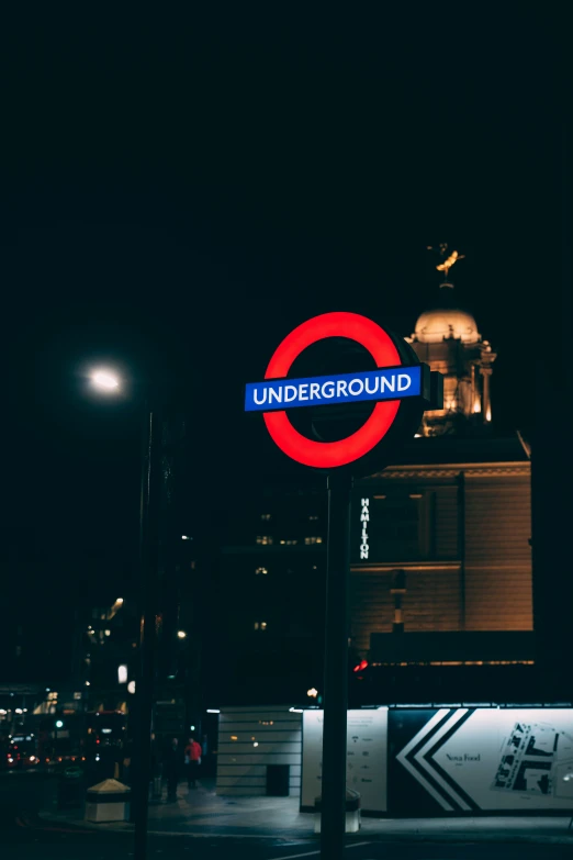 large illuminated sign on city street in urban area