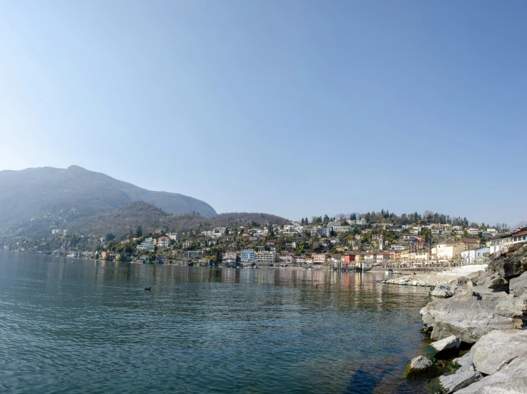 a view of a village on a small island on the edge of the water