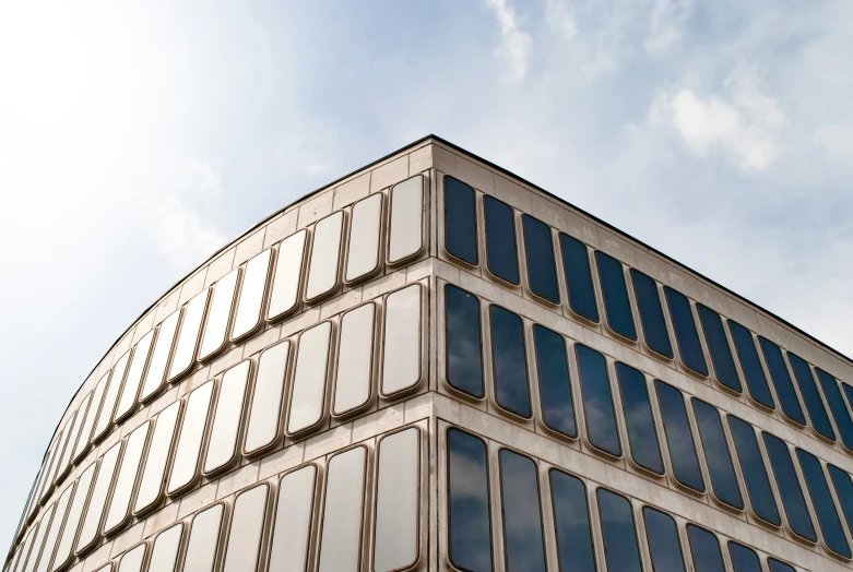 an office building in the sun with lots of windows