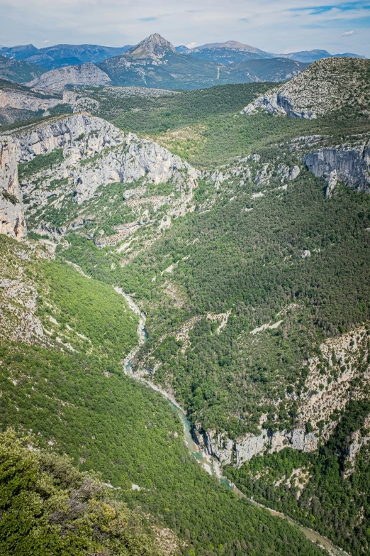 there is a very long winding river in the mountains