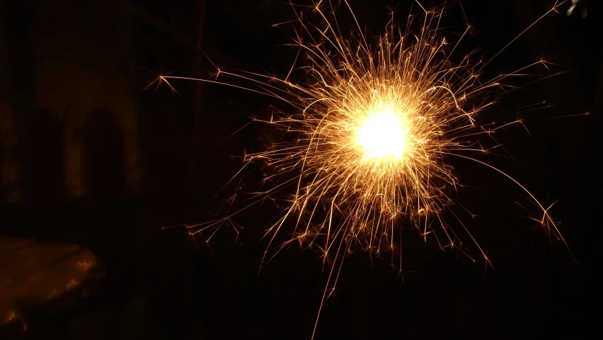 fireworks that are shining in the dark night sky