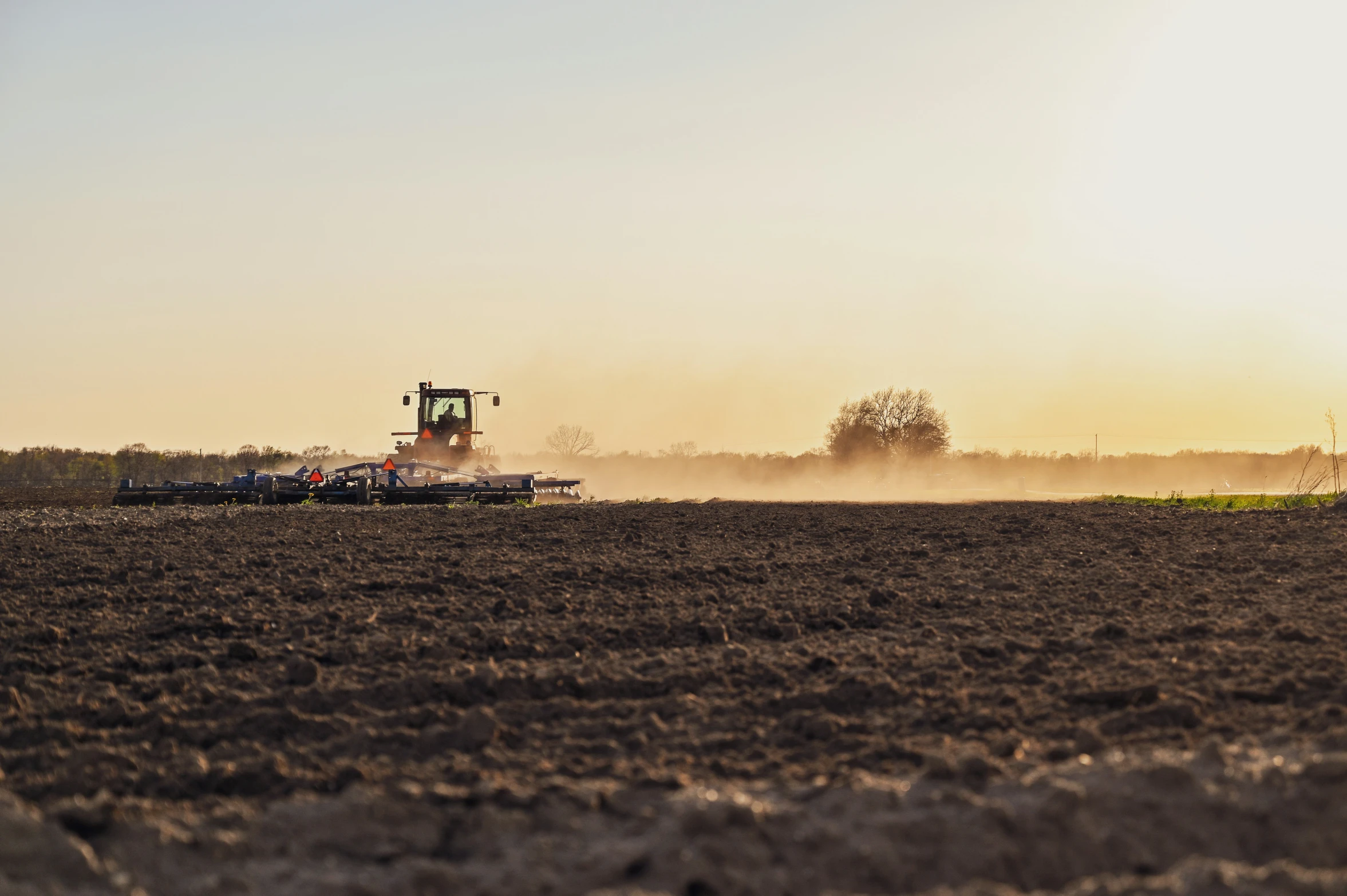 an tractor in the middle of the field