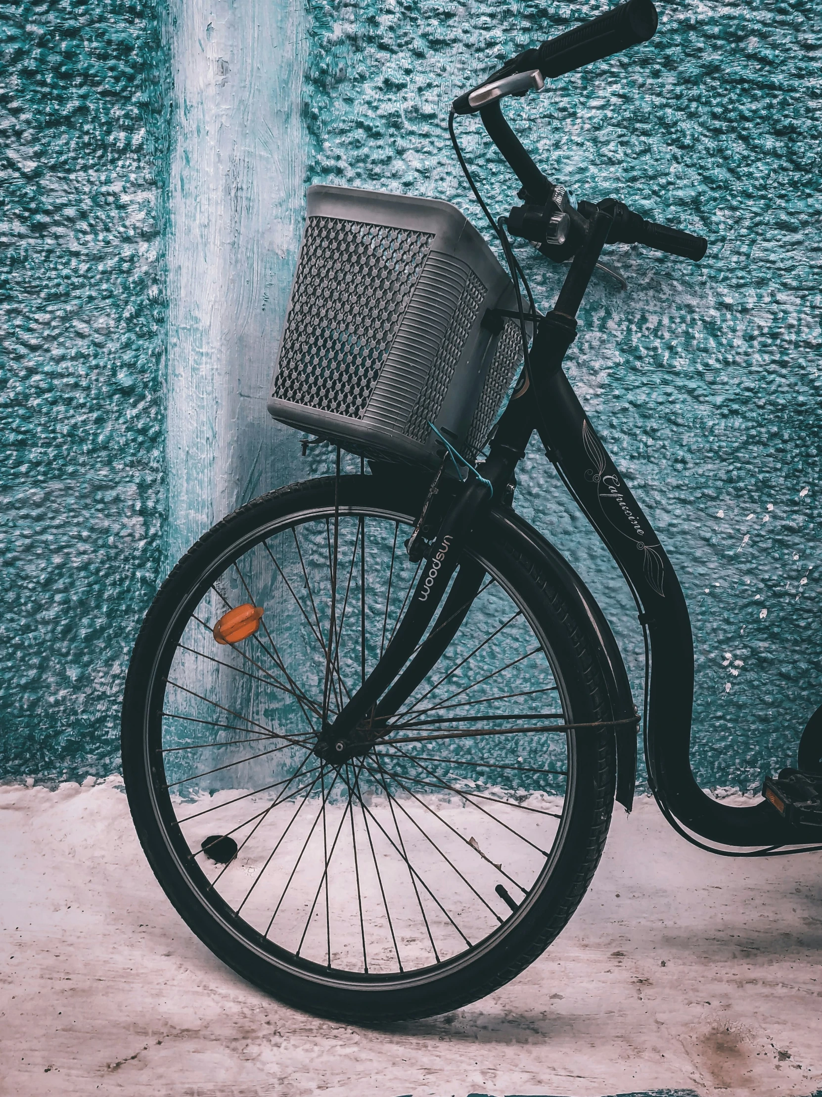 a bicycle and a water fountain outside a building