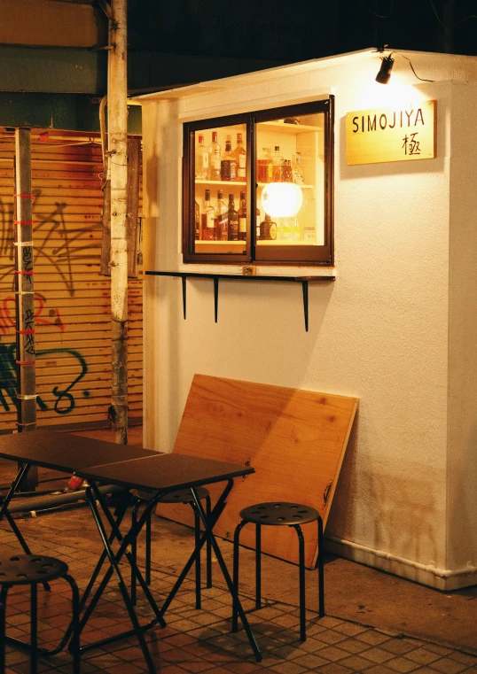 the corner of a restaurant with chairs and tables