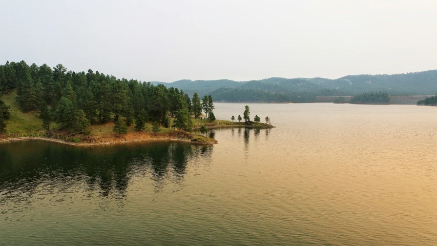 an island sitting in the middle of the lake