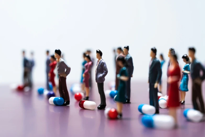 group of people posed on small balls and sticks