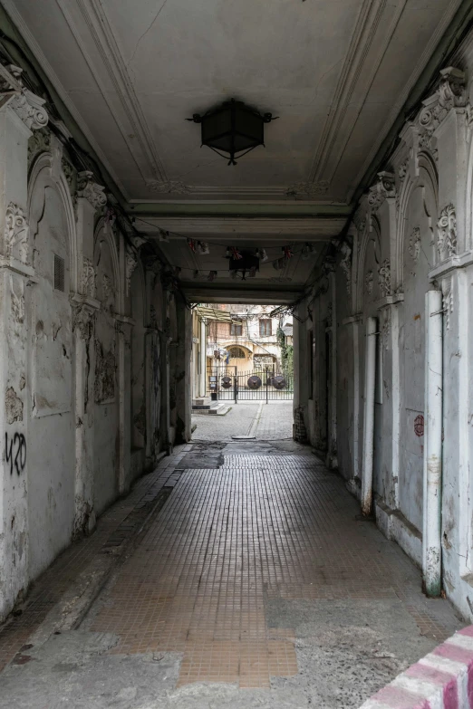 the ceiling of an abandoned building is littered with graffiti