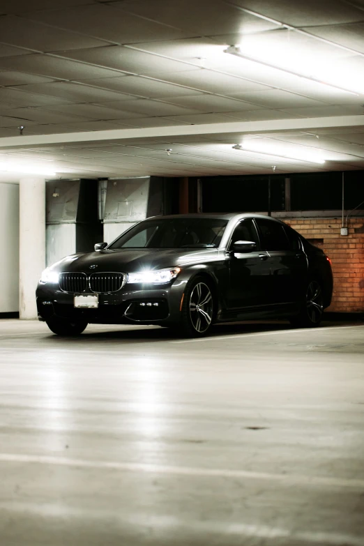 a black car parked inside of a building