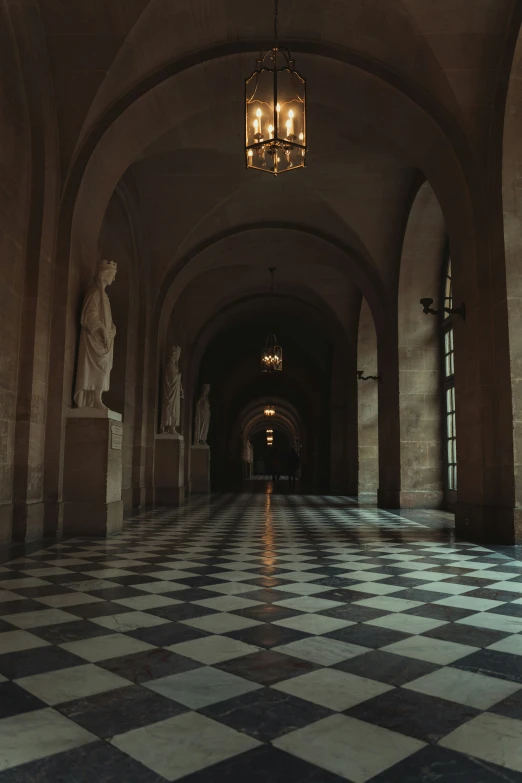 a black and white checkered floor with lampposts