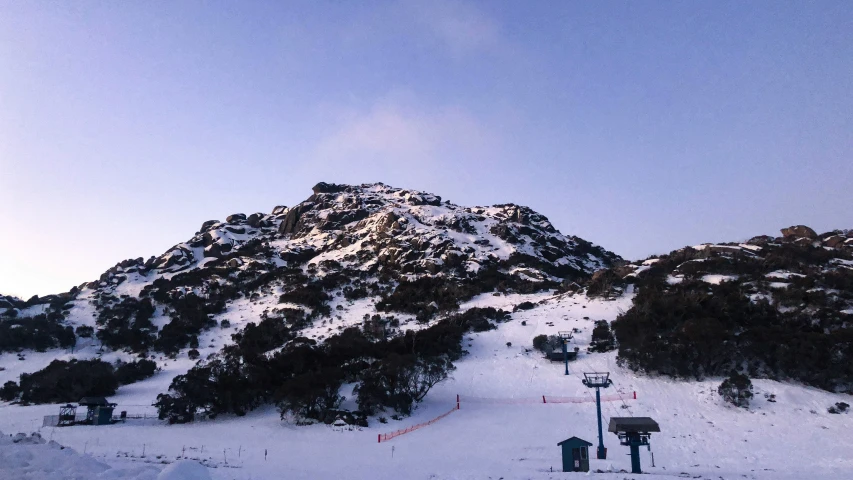 the mountains are covered with lots of snow