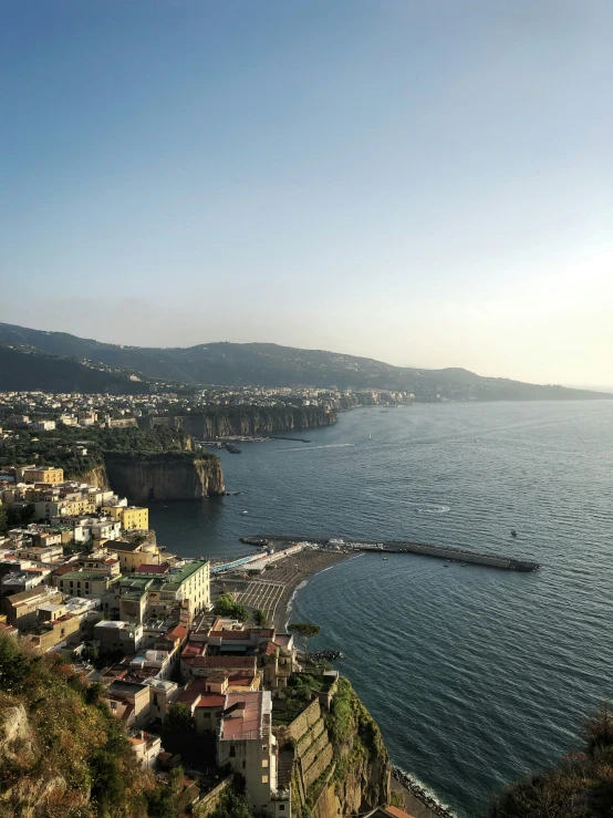 looking down at some beautiful town on the water's edge