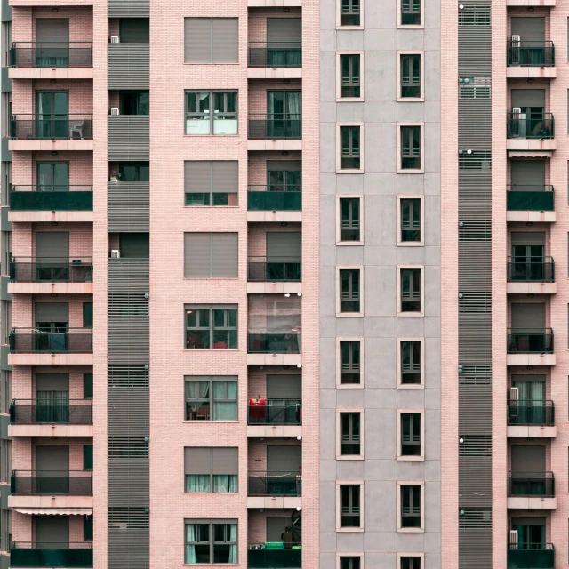 a large building has several windows and balconies