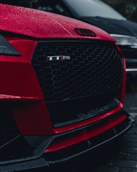 red audi cars in a parking lot