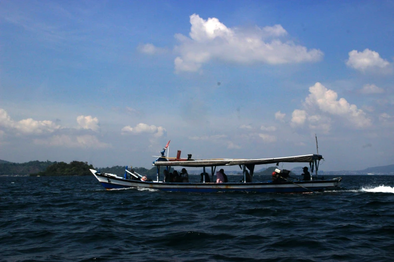 a boat with four people riding through water