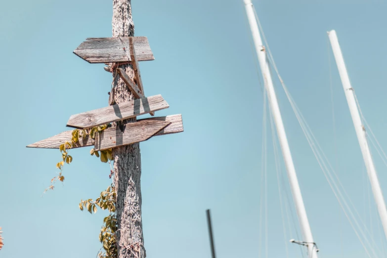 a wooden cross that has graffiti on it