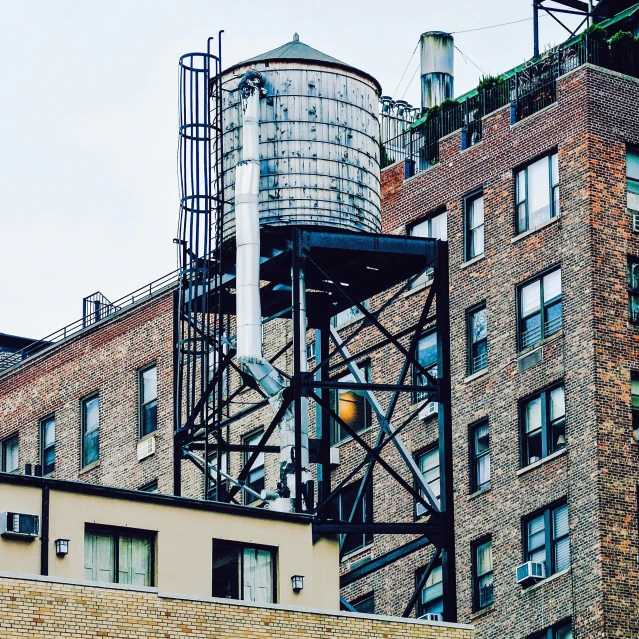 the building is tall and has a tower with many windows