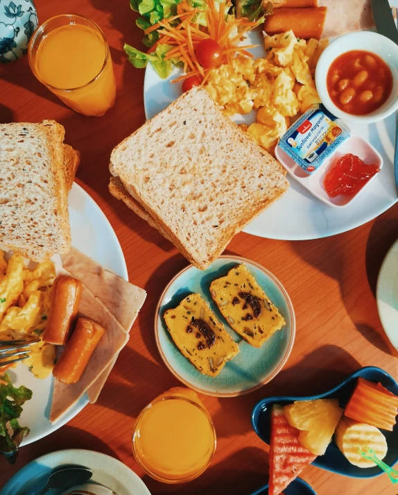 a bunch of food on plates and on a table