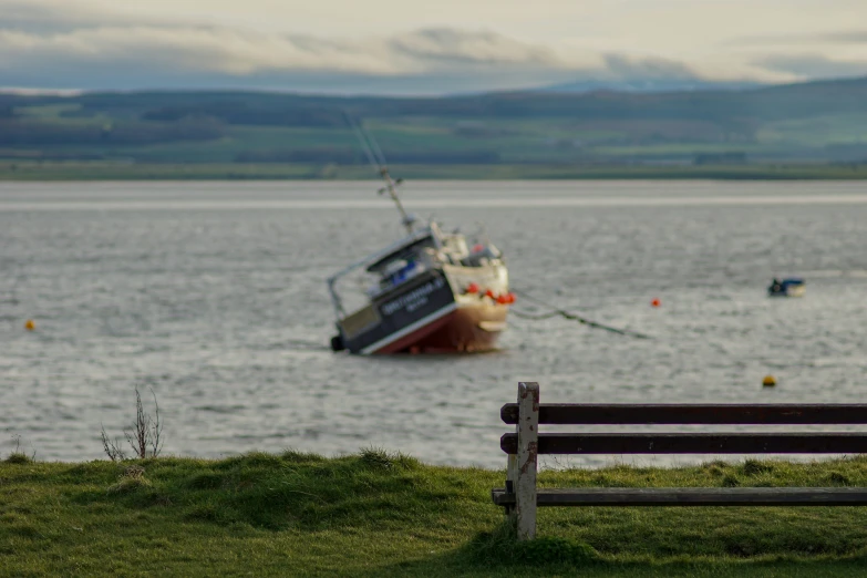 a boat is on the water off of shore