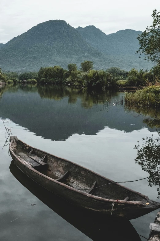 the small boat is in the middle of the water