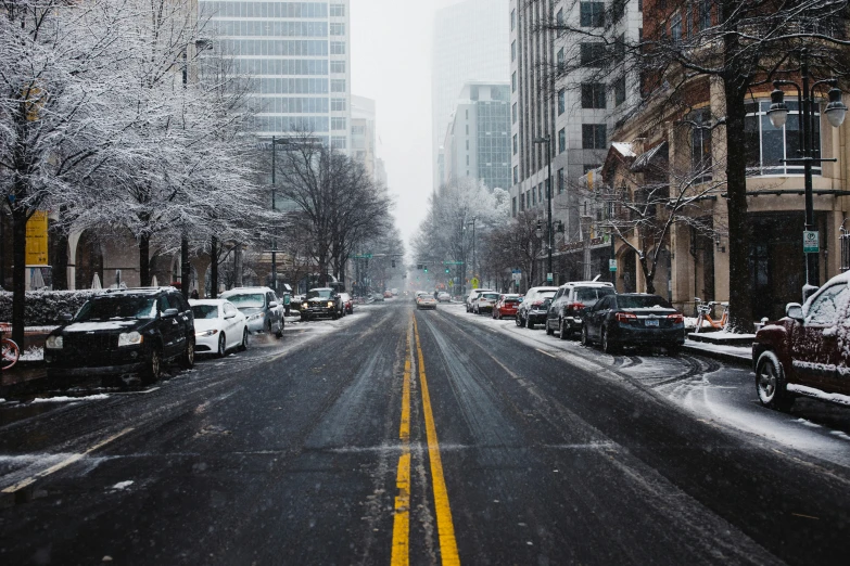 a city street with several cars parked along it