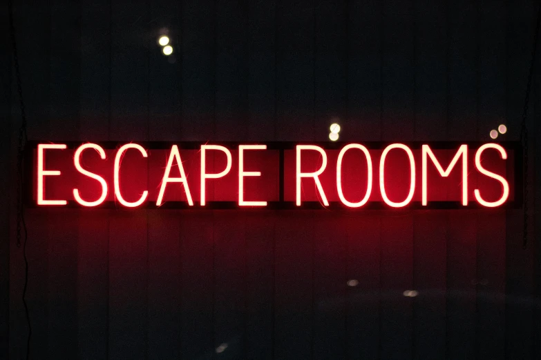 red escape rooms sign lit up at night