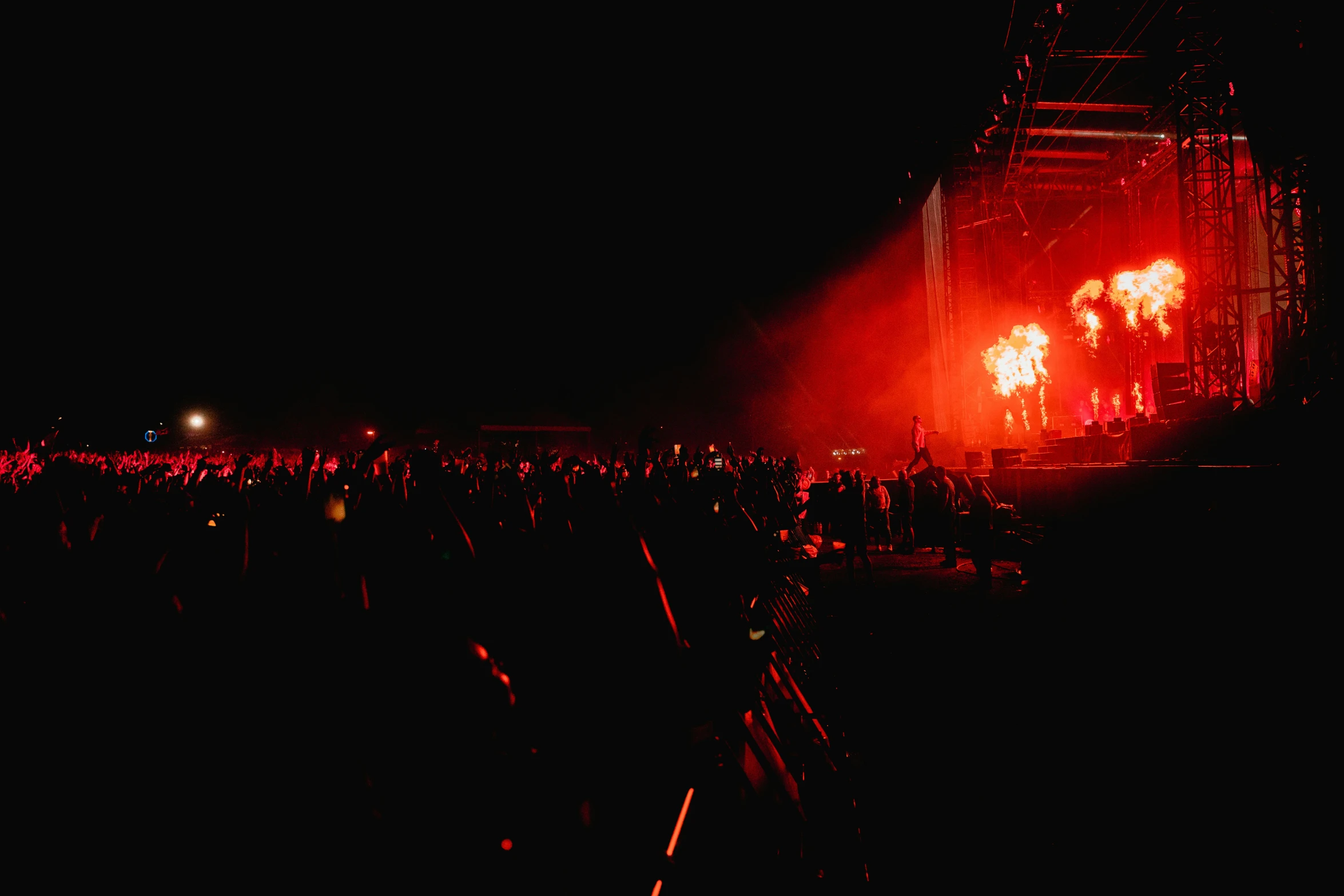 red lights are illuminating on an outdoor concert