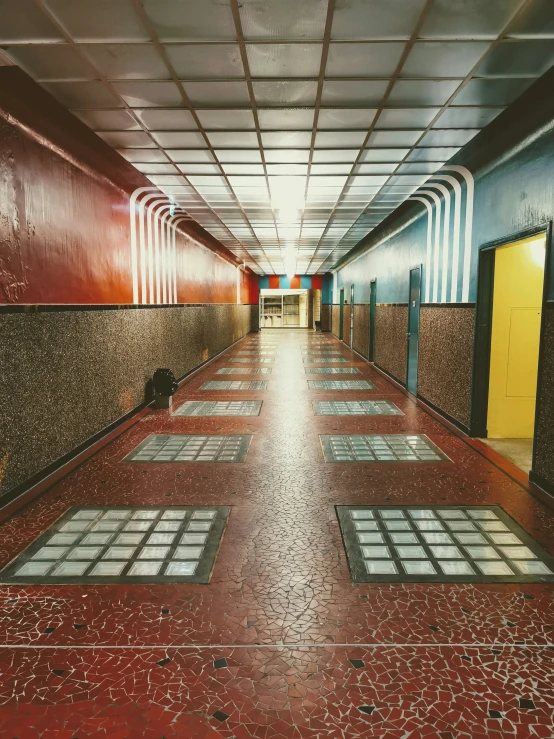 an empty building that has a bunch of benches on it