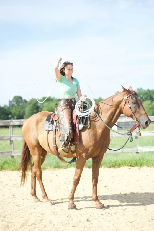 a woman is sitting on top of a horse