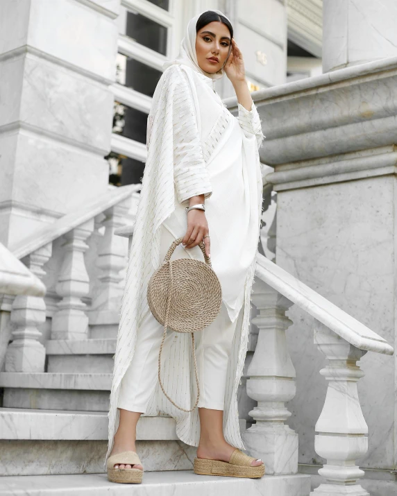 a woman standing on the steps talking on her cellphone