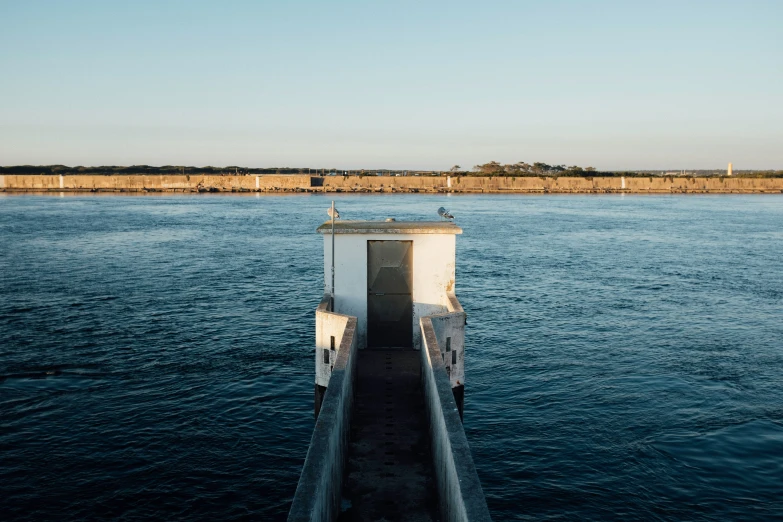 a dock leading into the water for people to enter