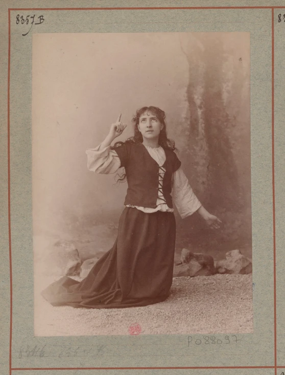 a vintage picture shows a woman dressed in traditional western dress