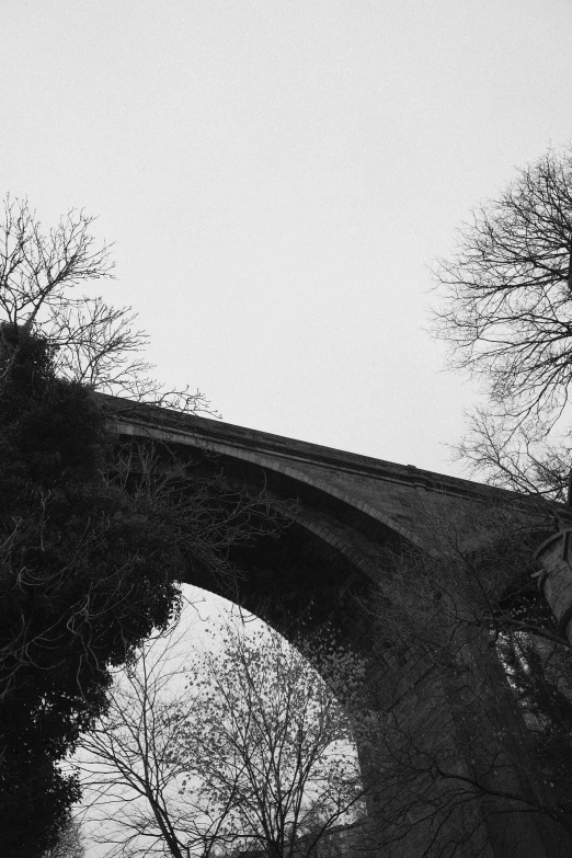 black and white po of an old stone bridge