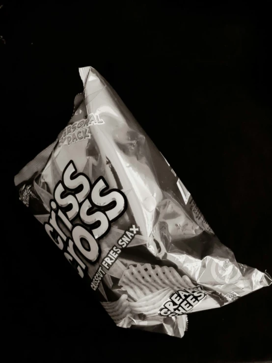 a bag of cheese chips on a black background