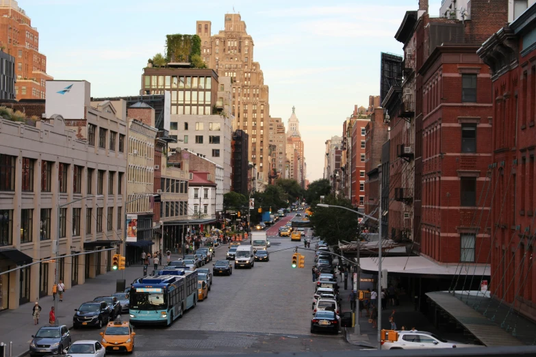 a city street is lined with buildings and cars