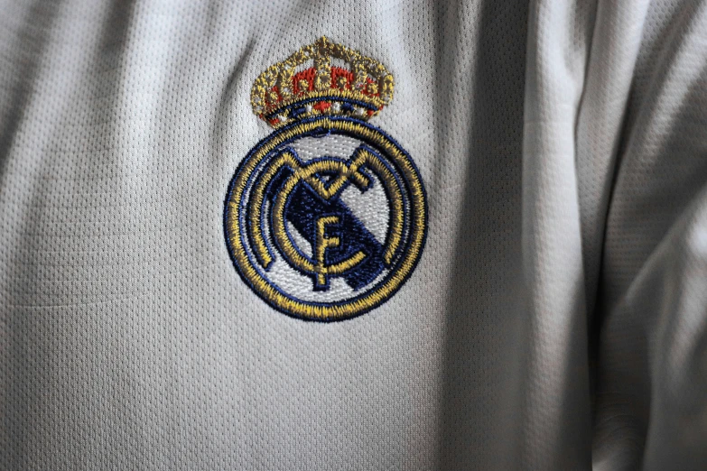 close up of a real madrid shirt and a crown