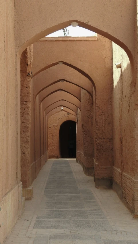 a line of archways in the middle of a street