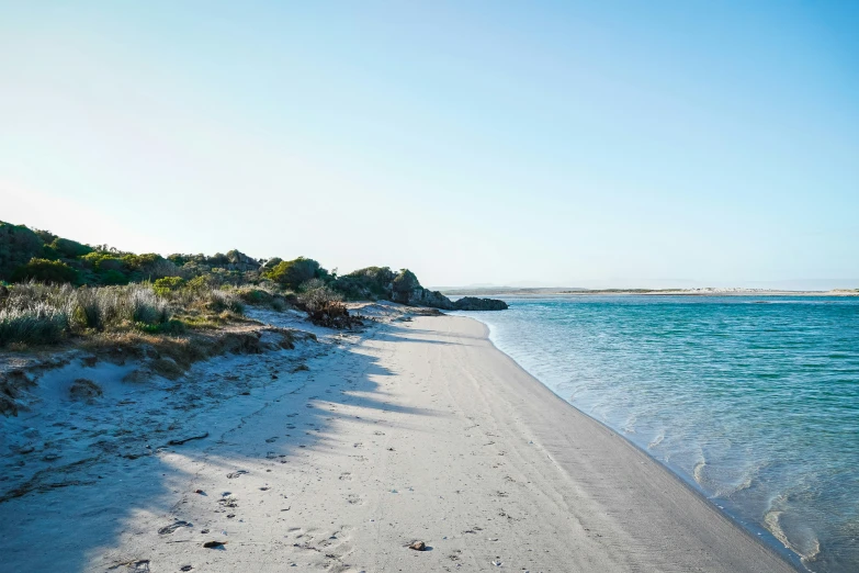 a large body of water next to the shore