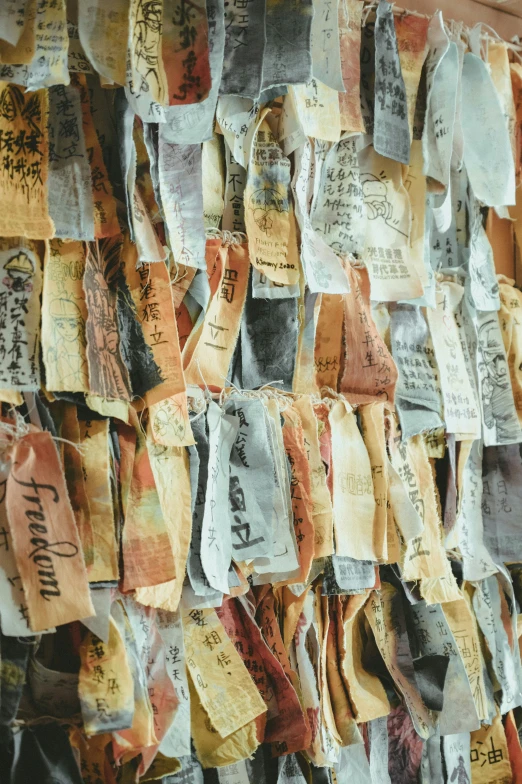 a lot of different papers hanging on a wall