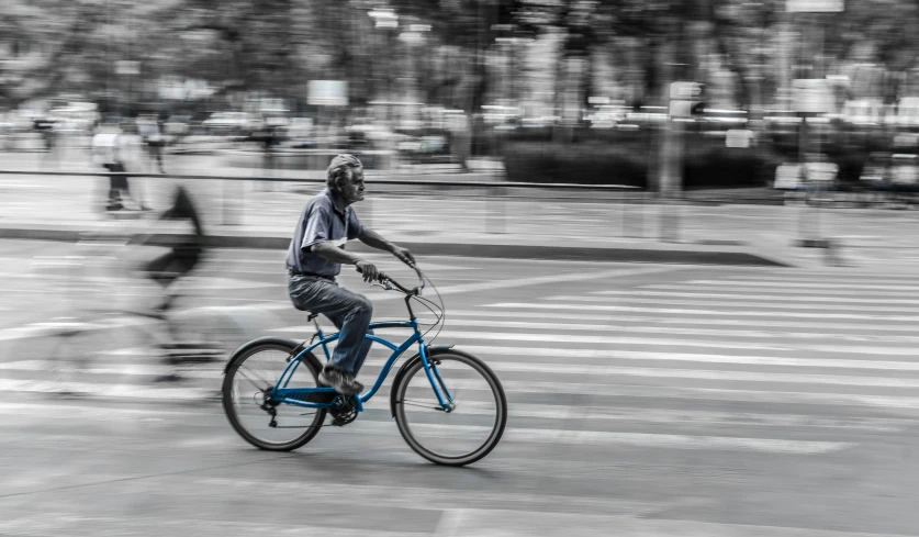 a man riding his bike on the street
