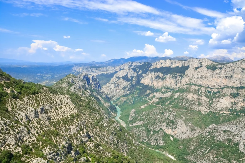 mountaintop and river as seen from viewpoint on sunny day