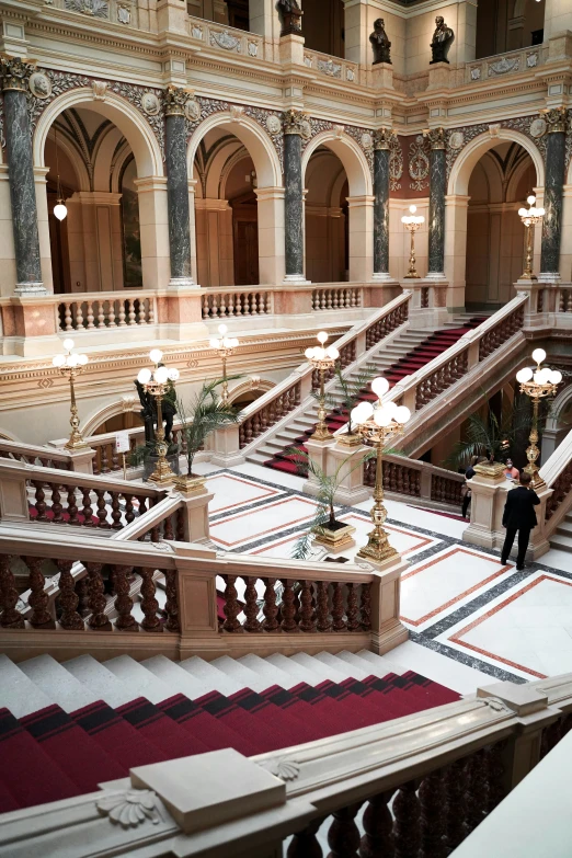 a very large building with two people on the second floor